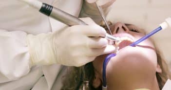 Dentist Working Working on Woman's Teeth